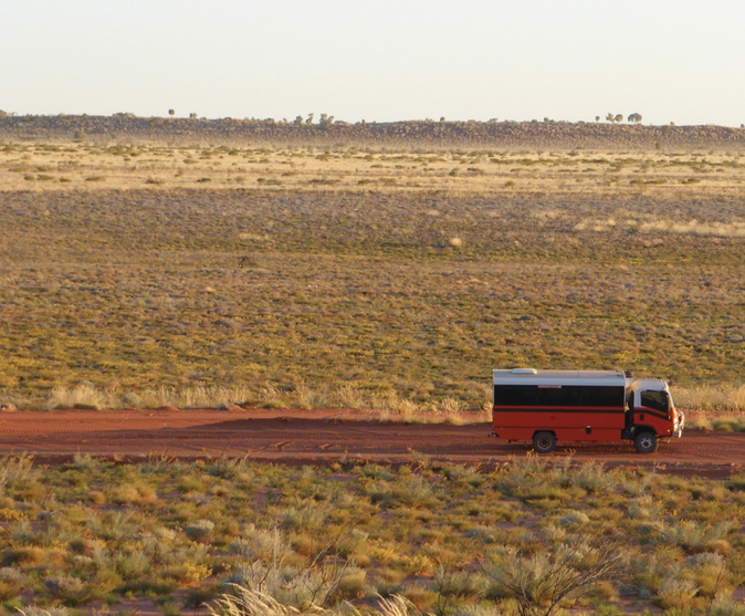 FCB bus across vast red Kimberley landscape